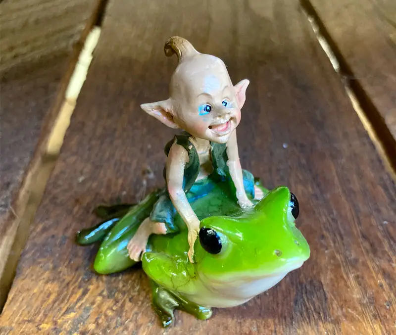 Impish fairy riding a toad is one of the fun kids gardening supplies at The Dutch Plant Farm.