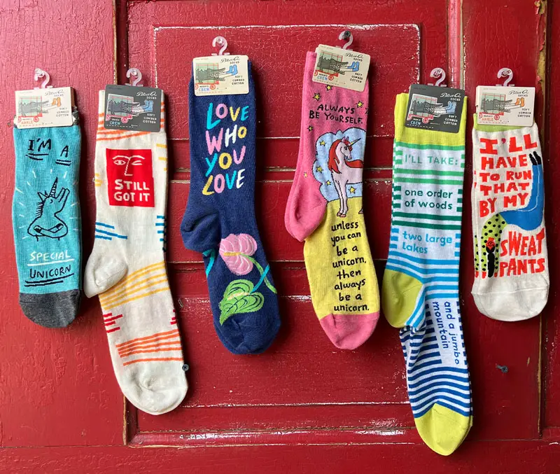Display of soft cotton socks with fun sayings on them are some of the fun accessories available at The Dutch Plant Farm store.